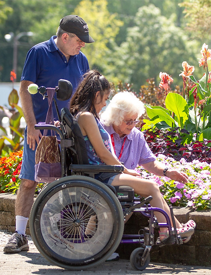 A visitor admires the flowers.