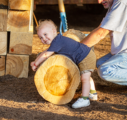 A little boy on a log