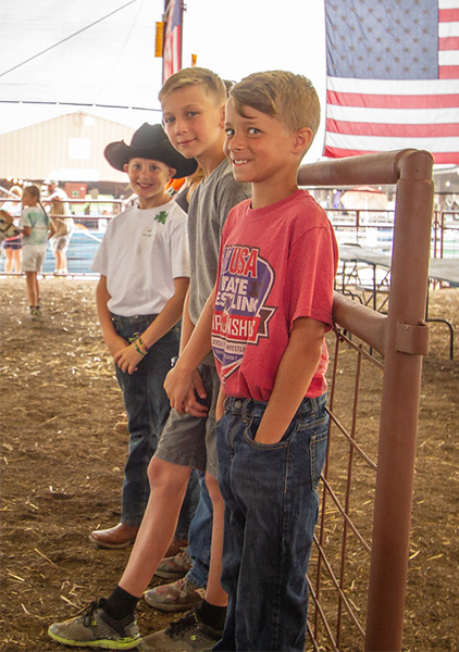 Three boys in the Agricultural Area.