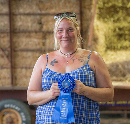 A girl showing her ribbon