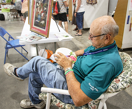 Man doing embroidery