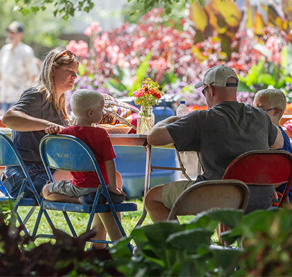 A family enjoys an outdoor picnic.