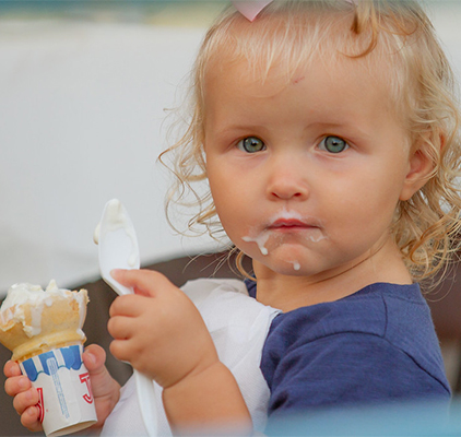 Little girl eating ice cream