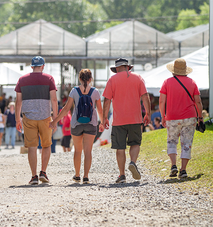 A family walking through The Fair.